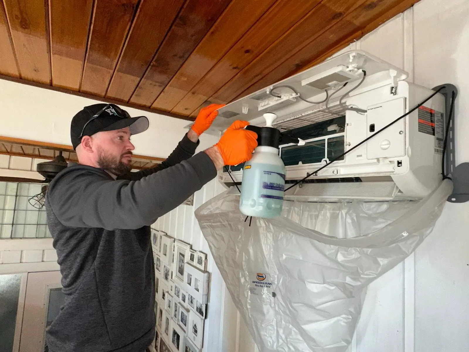 HVAC tech cleaning a mini split