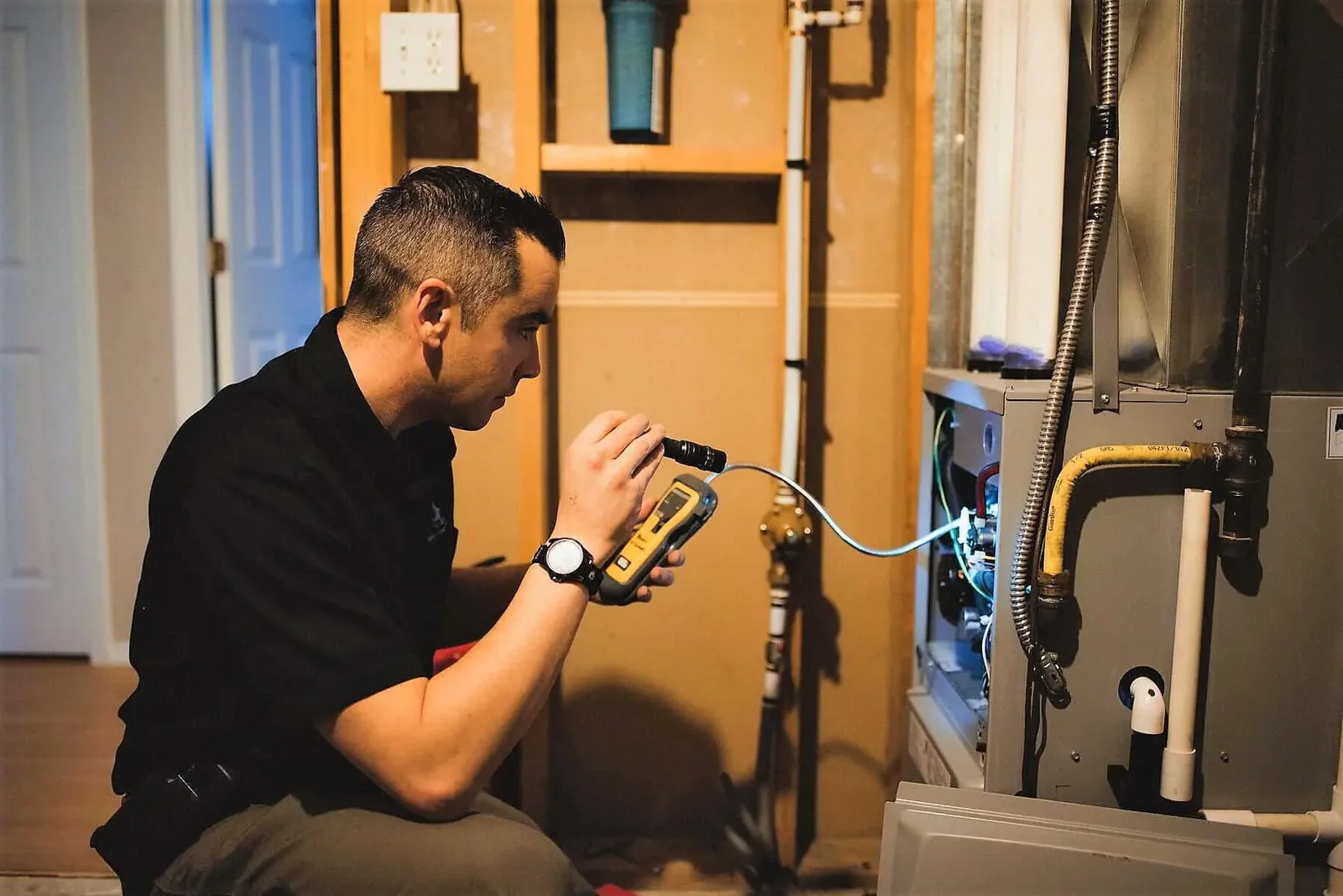 HVAC tech conducting gas leak detection