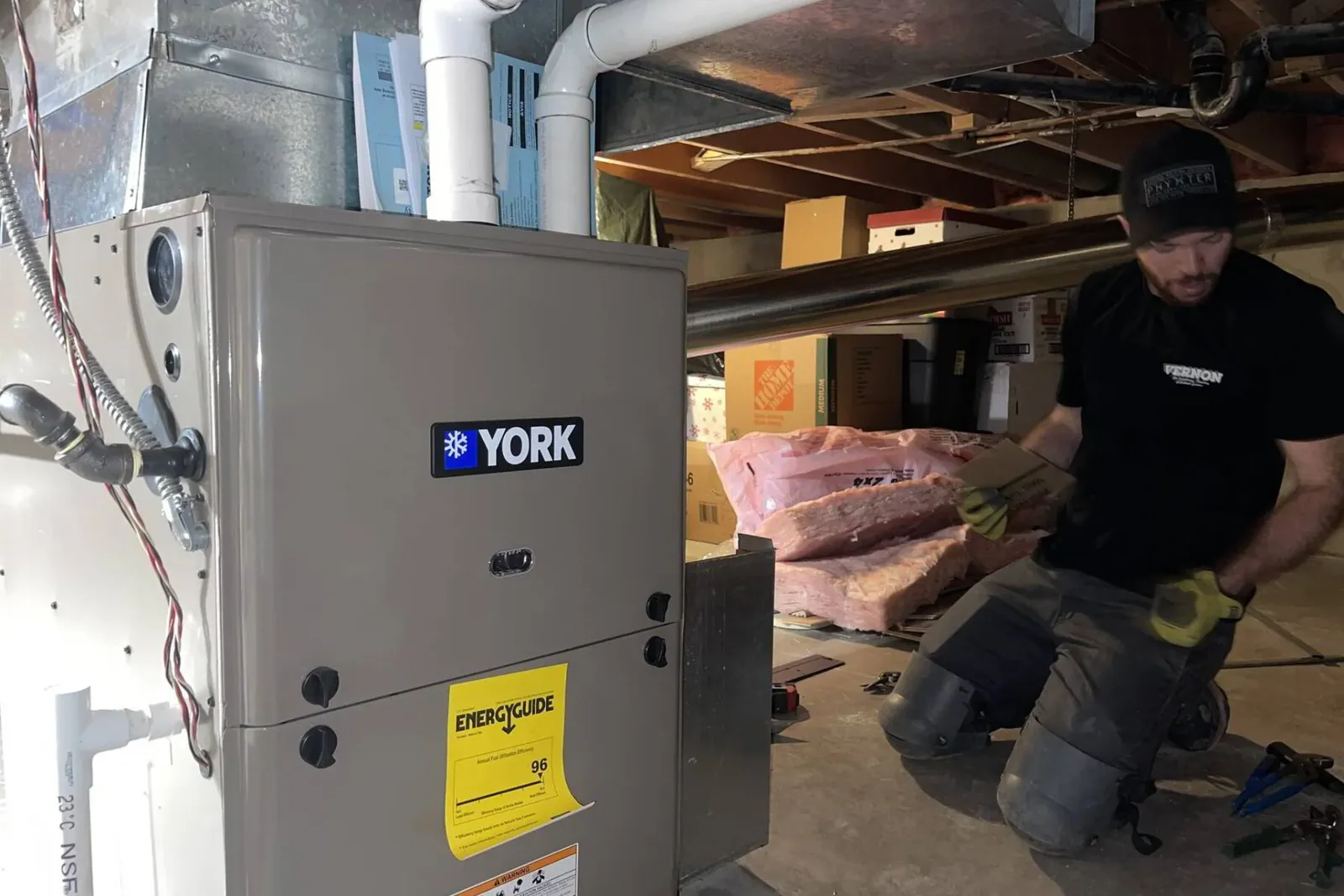 Professional HVAC technician repairing a heat pump