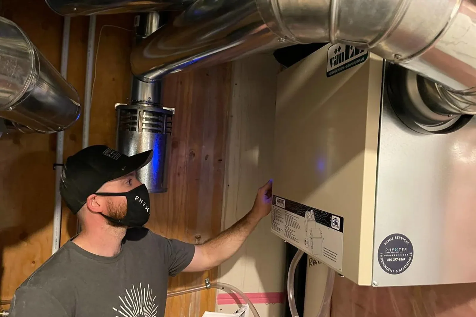 HVAC Tech installing an HRV